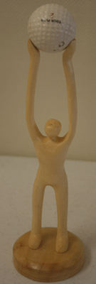 carved man with golf ball